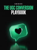 The UGC Conversion Playbook ebook cover, a glowing emerald speech bubble with a heart on black, from Buscemi IT Solutions